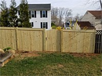 <b>Pressure Treated Privacy Fence with Fascia and arched walk gate</b>